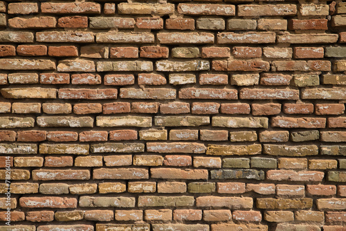 Wall background of bricks with different shades and worn by the passage of time. Concept background  wallpaper  copy space  construction.