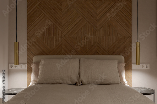 Elegant bedroom interior with textured headboard design photo