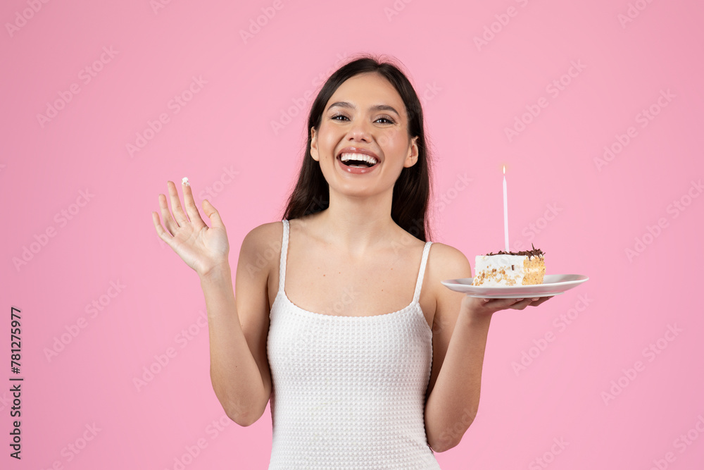 Naklejka premium Happy woman celebrating with cake and laughter