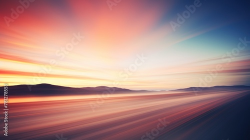 With an emphasis on speed, this image features a dynamic blur of colors as if racing through a vibrant landscape at dusk