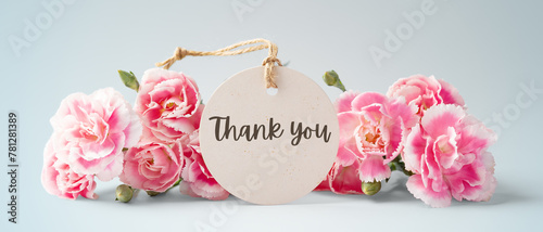 Thank you tag with pink carnation flowers on blue background