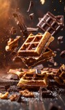 Belgian waffles with chocolate, flying ingredients. Tasty breakfast concept.