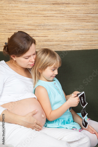 Little girl amazed by ultrasound images of her unborn sibling