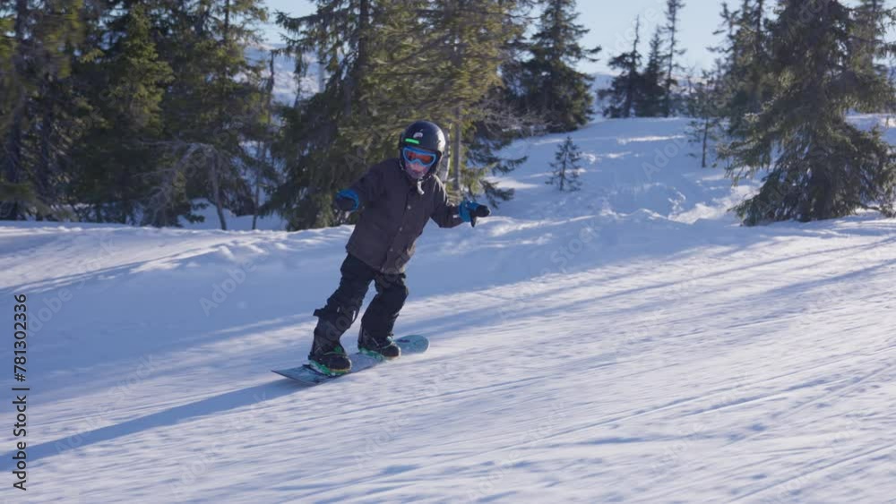 Young Snowboarder Hits The Slopes