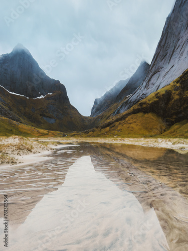 Horseid beach mountains and flooded sand dunes water reflection in Lofoten islands landscape in northern Norway travel scandinavian nature beautiful destinations photo