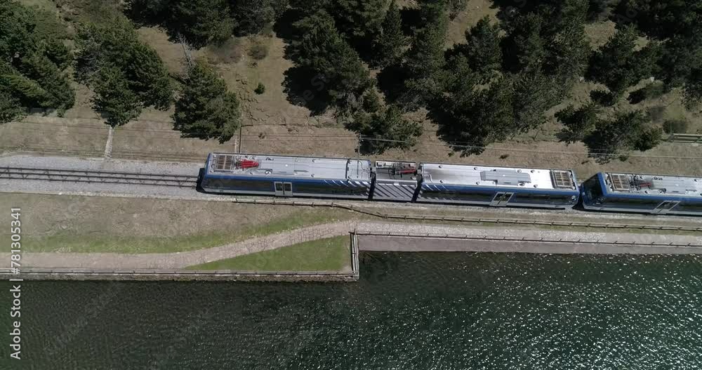 Drone view mountain resort, sanctuary and reservoir in Catalan valley of Vall de Nuria. Spain, Barcelona, Girona. Cogwheel train and railway with tunnel. Drone view mountain resort, sanctuary and reservoir in Catalan valley of Vall de Nuria. Spain, Barcelona, Girona. Cogwheel train and railway with tunnel.