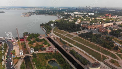 A beautiful view from above of the largest hydroelectric power plant in Ukraine - the Dnieper Hydroelectric Power Station. Dneproges before the shelling of Russian troops. Top view city of Zaporozhye. photo