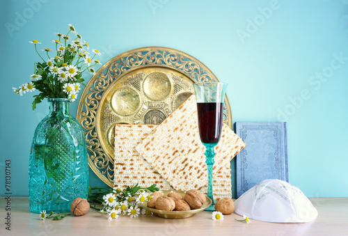 Pesah celebration concept (jewish Passover holiday). Translation of Traditional pesakh plate text: Passover, shankbone, bitter hearb, sweet date © tomertu