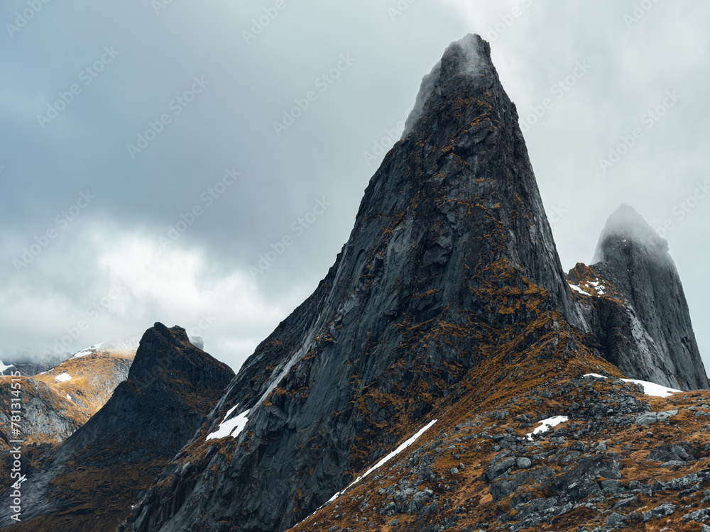 Mountain rock peak in Lofoten islands moody landscape travel in northern Norway arctic scandinavian nature epic view