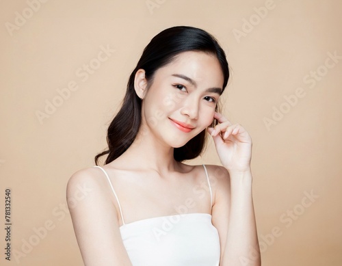 Beautiful young asian woman smile with clean fresh skin Happiness and cheerful with positive emotional,isolated on beige background,Beauty Cosmetics and Facial treatment Concept