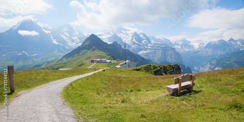 pictorial hiking route Mannlichen mountain, with bench and alps view, switzerland