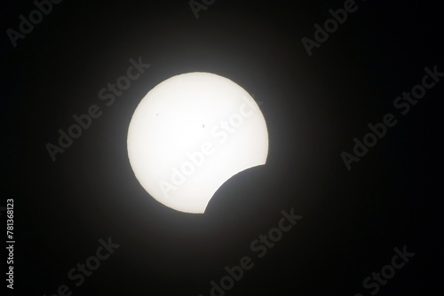 The view of a partial solar eclipse during the North American eclipse of 2024. Sun spots are visible.