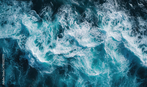 Aerial view to ocean waves. Blue water background photo