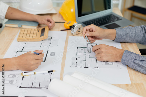 Architects at a meeting discussing house plans are reviewing draft house plans. Projects assigned by customers and customized design before delivery Interior design and decoration ideas