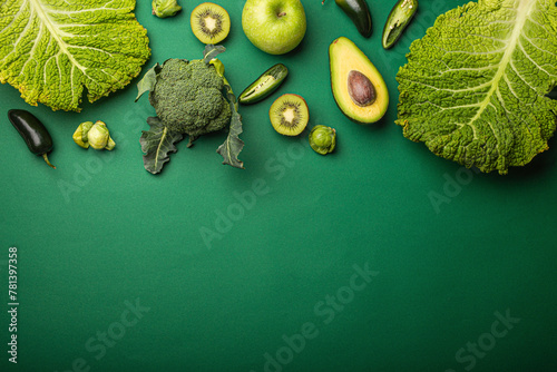 Green fruit and vegetables on green background