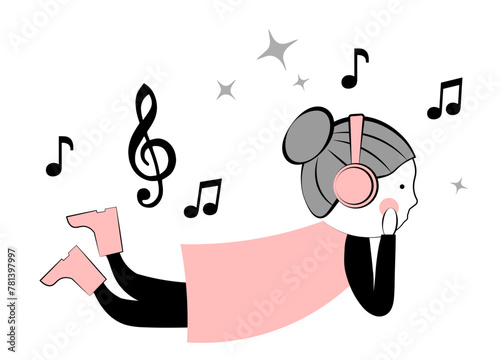 Cute little girl listening to music in headphones