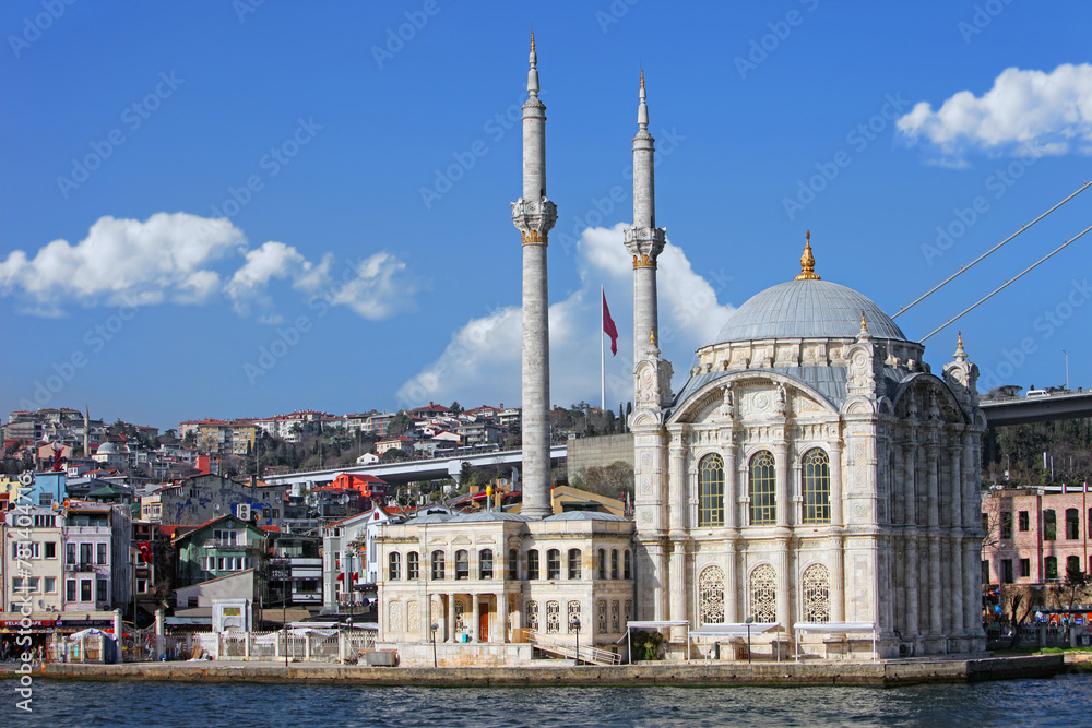 Beautiful view from the sea of Ortakoy Mosque at afternoon facing the Bosphorus canal, Istanbul, Turkey