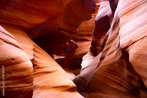 Antelope canyon in Arizona, USA ist a natural wonder, magic place and tourist attraction formed by the power of erosion. Red-orange sandstone washed out by water in colorul shapes illuminated by sun.
