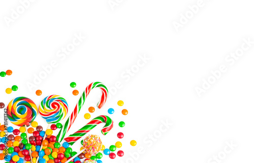 Colorful lollipops and different colorful round candy. Top view.