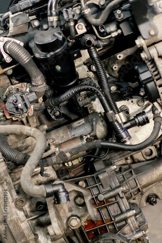 close-up At a service station detail of a rusty dirty engine is being repaired engine bolts and valves