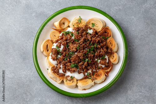 Turkish Manti with Yogurt, Minced Meat and Fried Butter Sauce From Artvin called Silor - Siron - Ziron Rolled Raw Dough and Fried Phyllo -Manlama with Dill photo