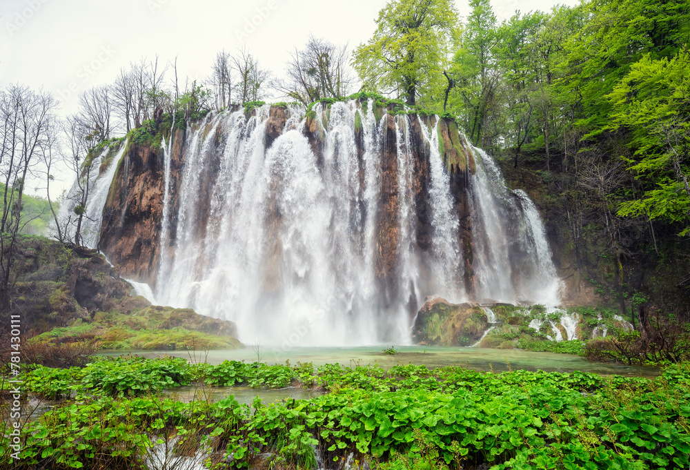 Amazing picture with some of picturesque waterfalls in the green spring forest of Plitvice national park in Croatia. Plitvice lakes closer view.. Amazing picture with some of picturesque waterfalls in the green spring forest of Plitvice national park in Croatia. Plitvice lakes closer view..