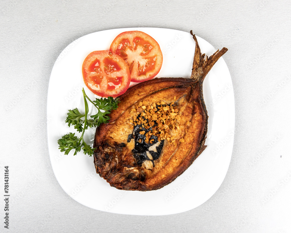 Top down view of fried Filipino milk fish, or Daing na Bangus
