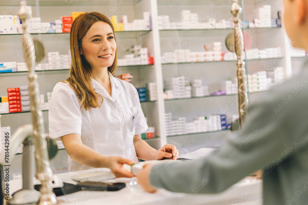 Woman, pharmacist consulting customer at counter for prescription drugs or medicine at the pharmacy. Male doctor giving patient medical antibiotics at the pharmacy for healthcare wellness Woman, pharmacist consulting customer at counter for prescription drugs or medicine at the pharmacy. Male doctor giving patient medical antibiotics at the pharmacy for healthcare wellness