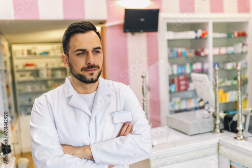 Portrait of male pharmacist at the modern pharmacy, drugstore.