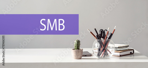 Wood letter of SMB abbreviation with hand writing definition