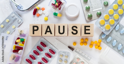 Pause Spelled Out With Pills and Capsules