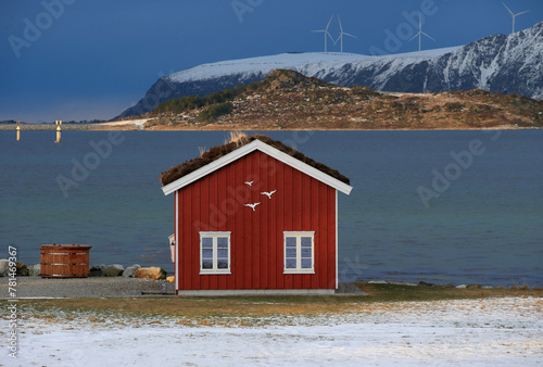 Winter landscape with red boathouse near Alesund, Norway. © andrzej_67