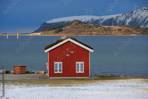 Winter landscape with red boathouse near Alesund, Norway. © andrzej_67