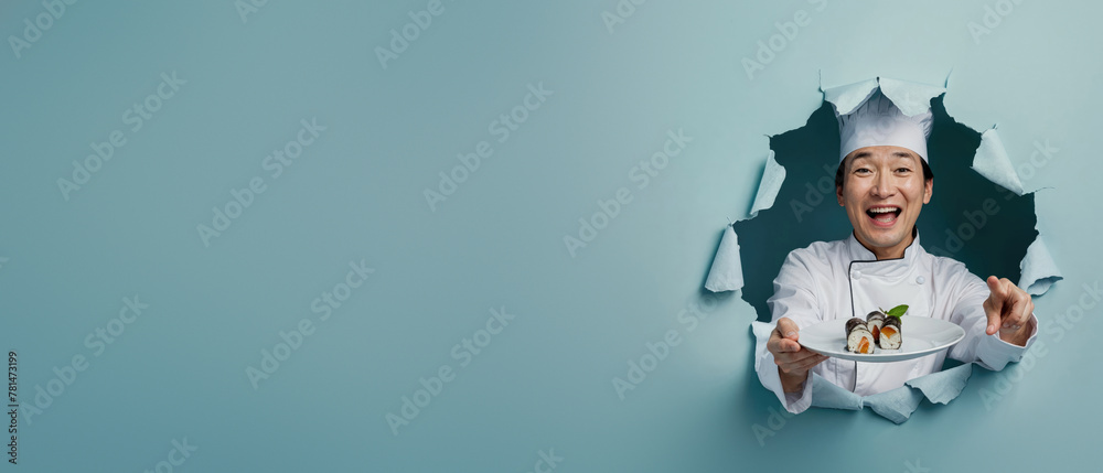 Asian chef in white uniform showing a plate of sushi through torn blue paper - obrazy, fototapety, plakaty 