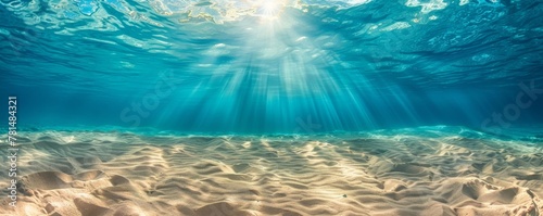 Serene underwater sunlight over sandy ocean floor