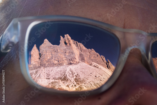 Reflection of Tre Cime di Lavadero in the Dolomite Mountains Italy in Hikers Glasses - Epic jagged mountains peaks in the Dolomiti National Park