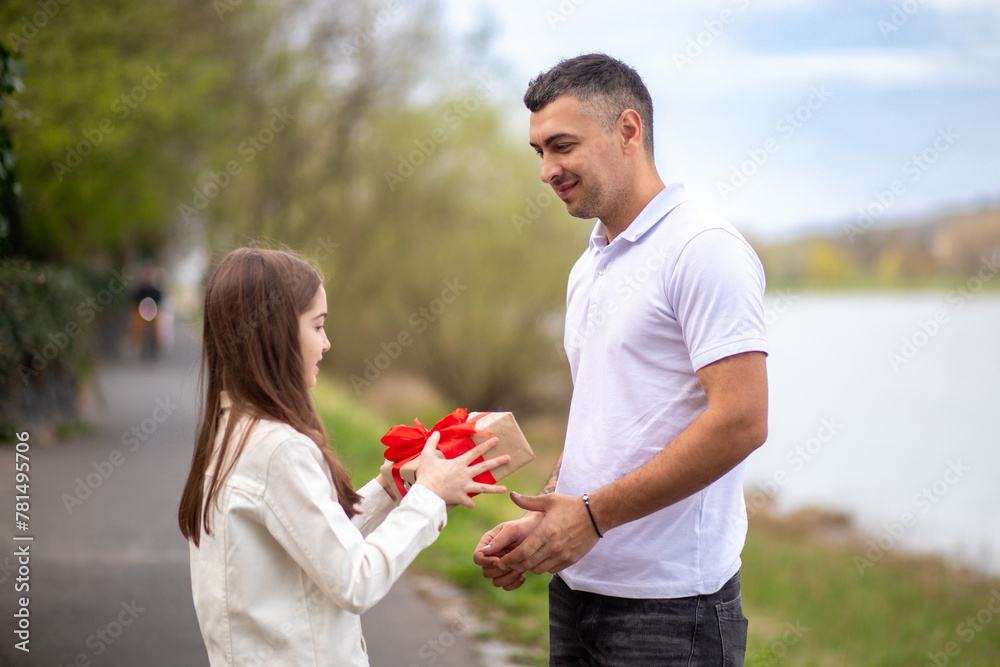 Father receiving gift from daughter