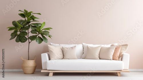 Modern living room with white sofa, beige pillows, and a large potted plant.