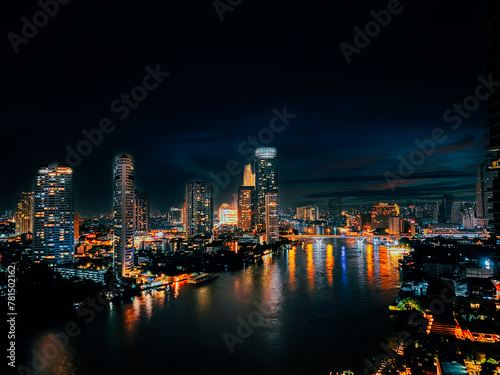 Beautiful architecture in Bangkok City skyline at night Filter effect Chao Phraya riverside at night  office buildings  Cityscape  night view in the business district at twilight capital of Thailand.