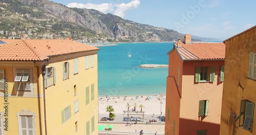 Serene Seaside Town at Midday With Clear Blue Skies and Tranquil Waters