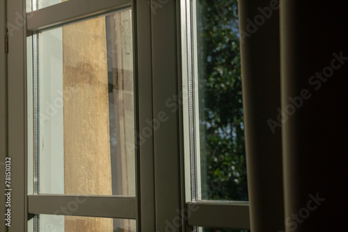 double glazed window with light and transparency effects, the solar reflections highlight the structure of the window and its particular important element for a home.