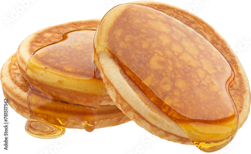 Stack of pancakes with flowing honey
