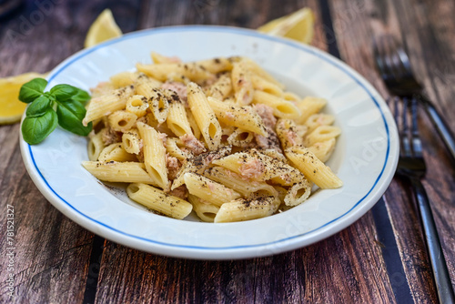 Italian home made   penne pasta  with  tuna  fish, parmesan cheese and black pepper .