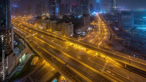 Cuadro en lienzo Dubai downtown skyline night to day aerial timelapse with traffic on highway