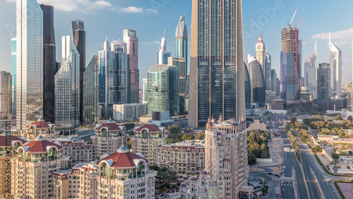 Aerial view on downtown and financial district in Dubai timelapse, United Arab Emirates with skyscrapers and highways.