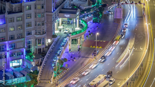 Skyline view of traffic on Al Saada street night timelapse in Dubai photo