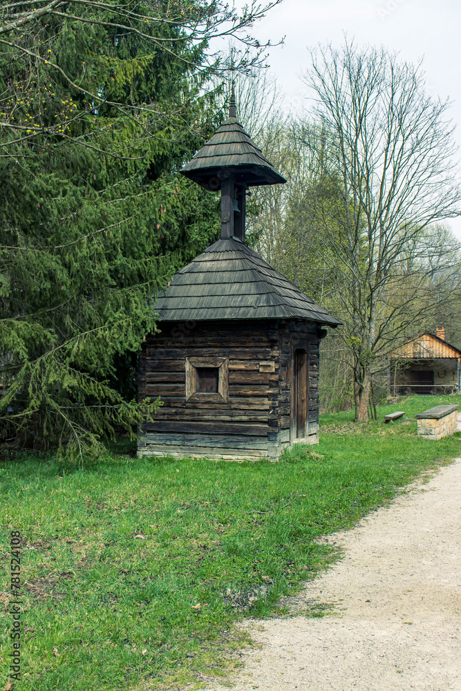 Old wooden building with a small bell tower. A building with a fire alarm bell in a wooden town. A wooden building with a bell Old wooden building with a small bell tower. A building with a fire alarm bell in a wooden town. A wooden building with a bell
