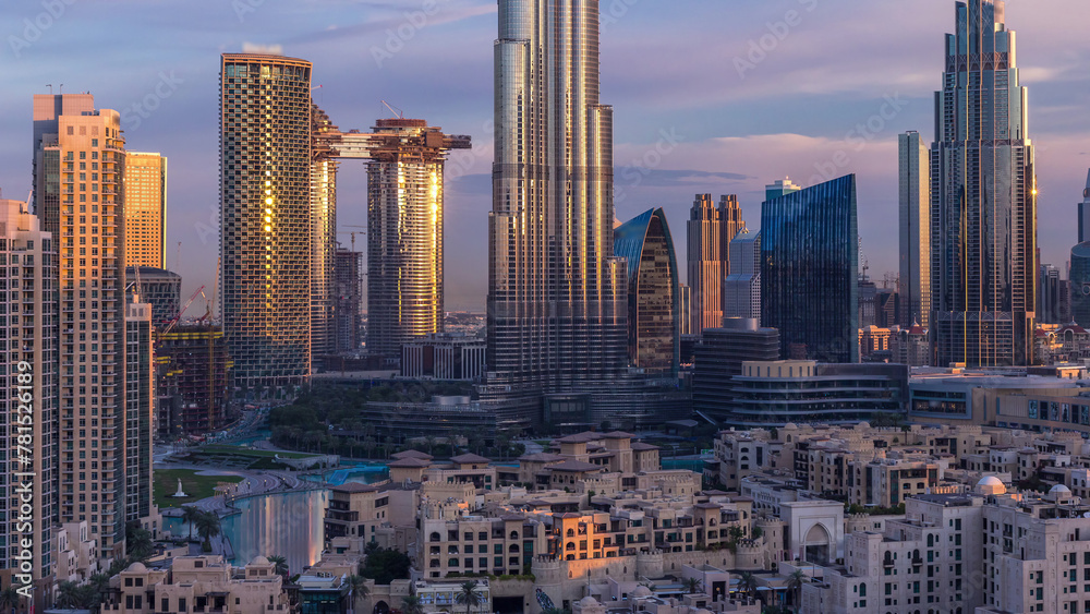 Obraz premium Dubai Downtown skyline during sunrise timelapse with Burj Khalifa and other towers panoramic view from the top in Dubai
