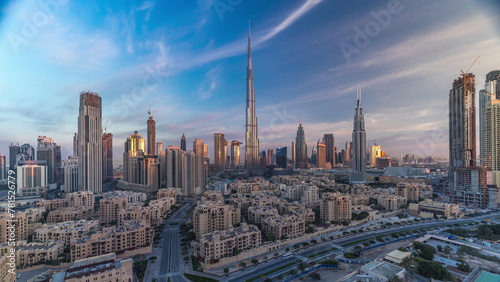 Dubai Downtown skyline timelapse with Burj Khalifa and other towers during sunrise panoramic view from the top in Dubai