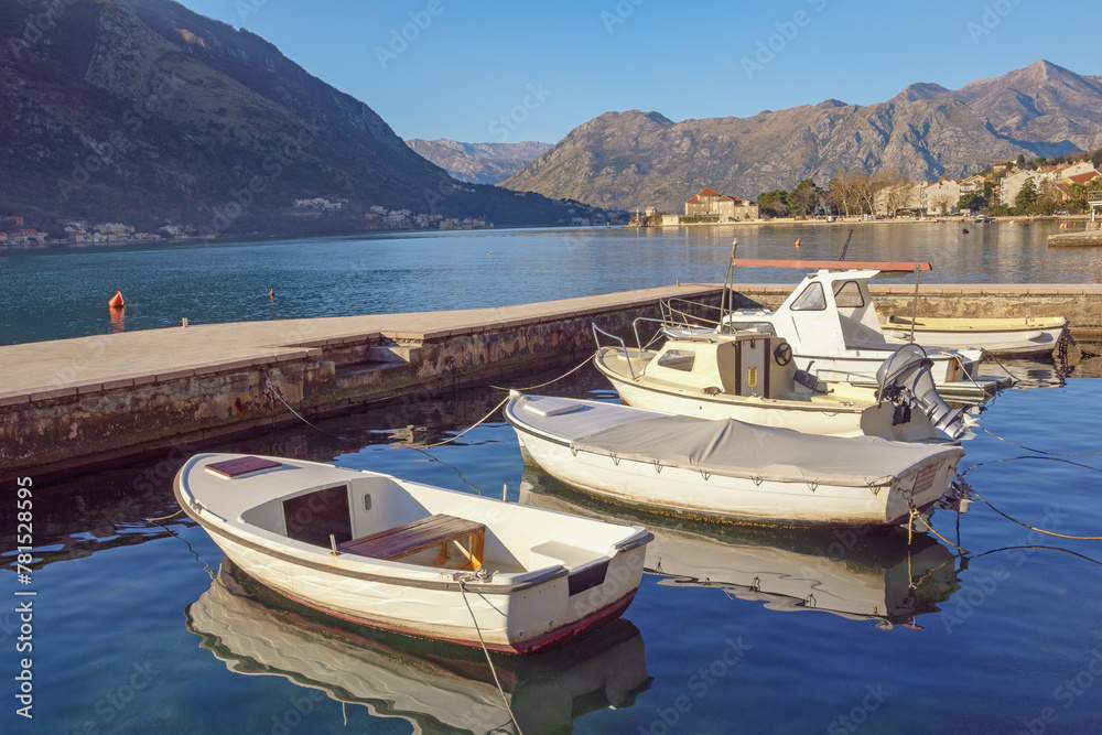 Beautiful Mediterranean landscape. Boats on water on sunny winter day. Montenegro,  Adriatic Sea, Bay of Kotor near Dobrota town